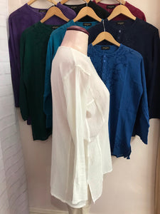 Long sleeves - wear rolled up when the weather's warm Round neck with button placket fastening Self coloured embroidery on the front & back Tie Dye - all slightly different due to hand dye techniques 100% Cotton crepe (cheesecloth) Actual measurements:- Chest approx 44-46”; Back length approx 27-28”; Underarm sleeve approx 17” Cool hand wash - dry out of direct sunlight