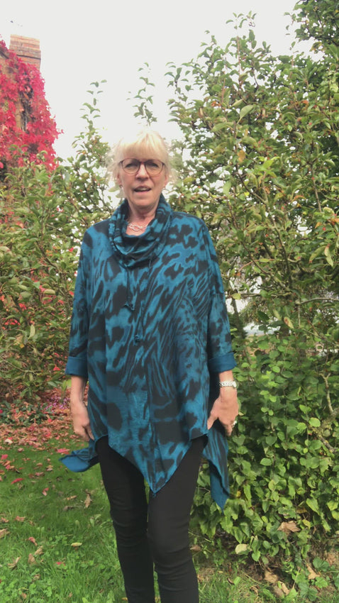 Fabulous cotton jersey tunic with a zig zag hem.   Cowl neck with drawstring Long sleeves Fits up to size 22 95% Cotton 5% Elastane 30 degree machine wash 3 colours - Hot Pink, Teal & Mocha