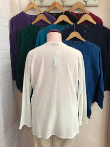 Long sleeves - wear rolled up when the weather's warm Round neck with button placket fastening Self coloured embroidery on the front & back Tie Dye - all slightly different due to hand dye techniques 100% Cotton crepe (cheesecloth) Actual measurements:- Chest approx 44-46”; Back length approx 27-28”; Underarm sleeve approx 17” Cool hand wash - dry out of direct sunlight
