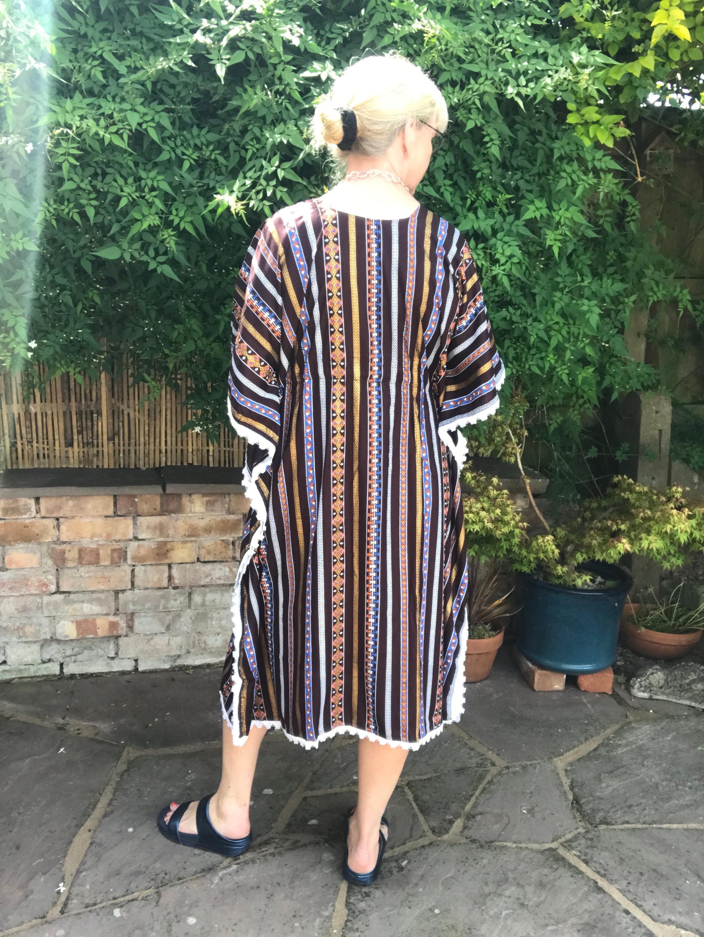 Cool kaftan for hot summer days and comfortable lounging.  One size - fits up to size 20 Back neck to hem length - 42" Comfortable cool viscose fabric  Four colourways Cool machine wash